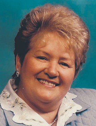 Mme Émilienne Côté